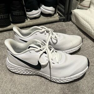 White and black Nike shoes